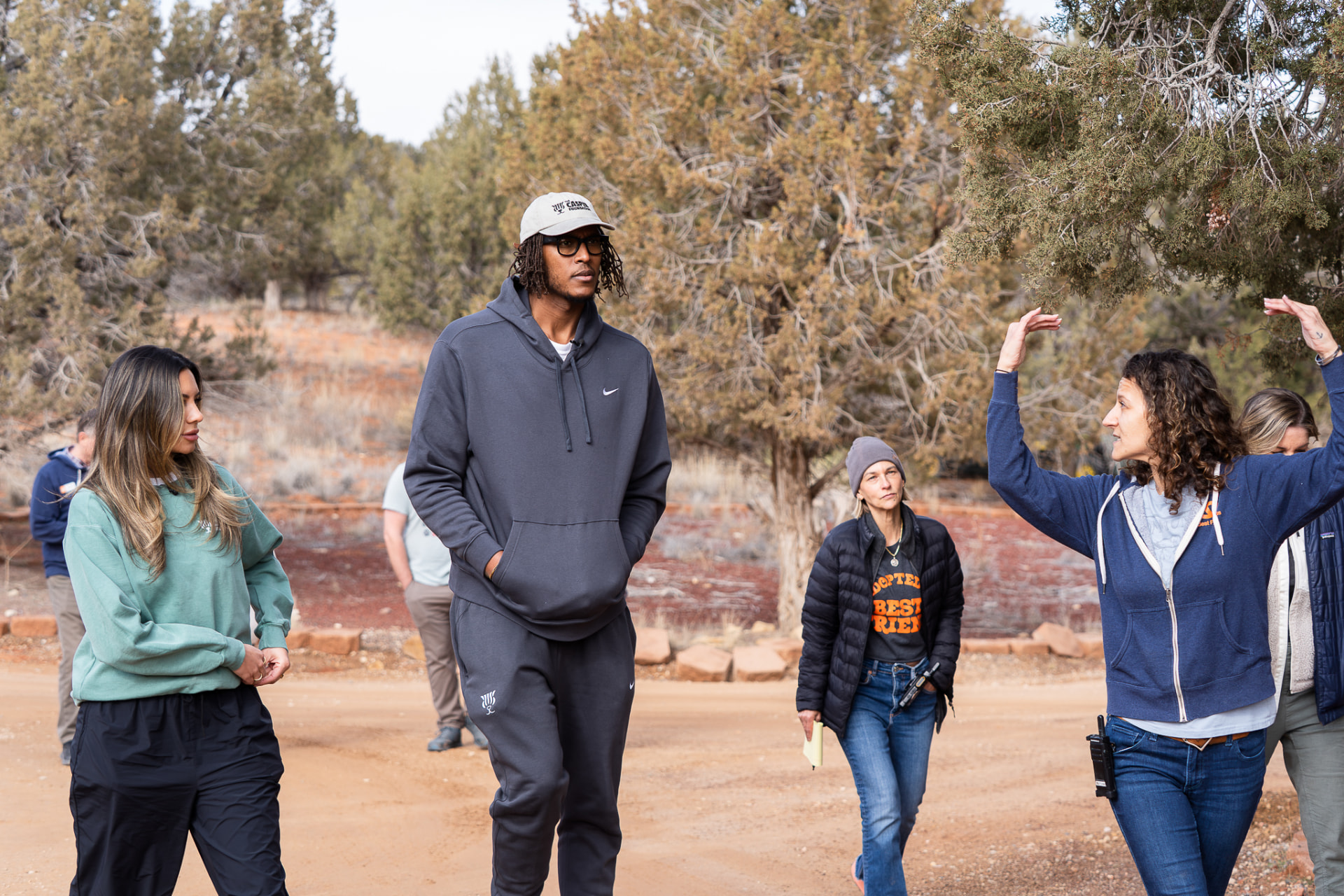 Casper Foundation team walking through an animal sanctuary with staff